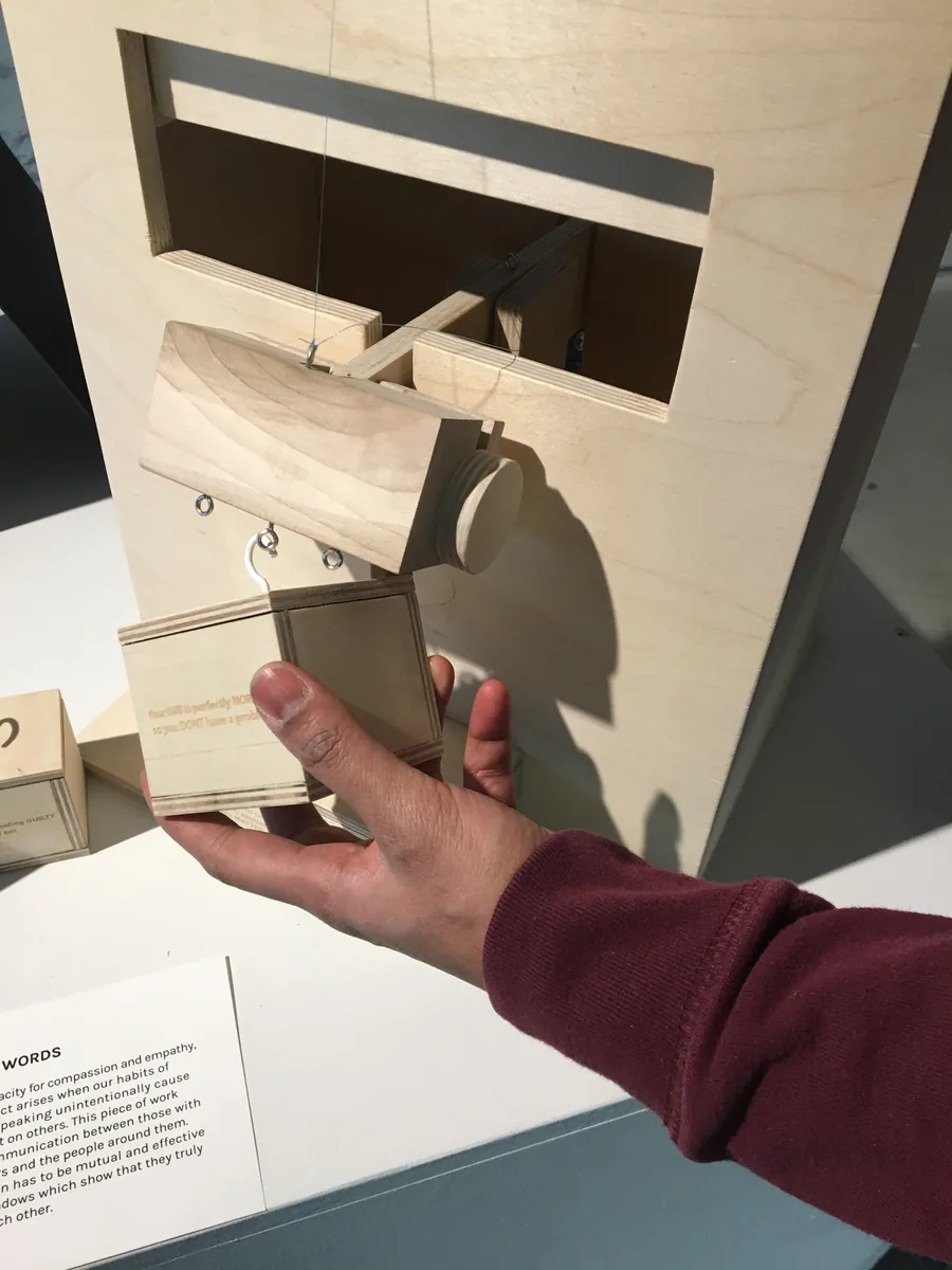 A visitor placing a word weight on the scale